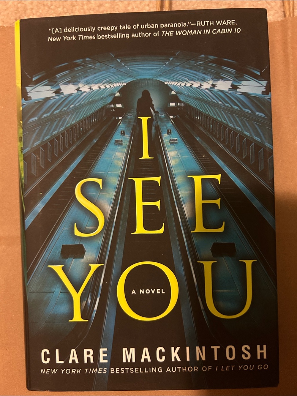 I SEE YOU by Clare Mackintosh - Dark Teal & Yellow Hardcover Novel